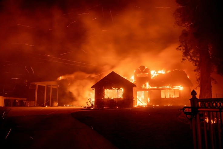 A home burns during the Hillside fire in the North Park neighborhood of San Bernardino, California on October 31, 2019.