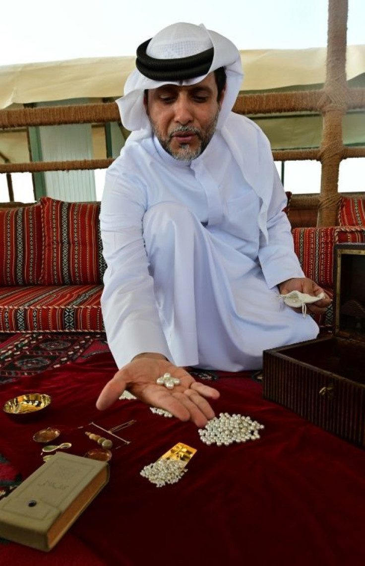 Emirati Abdullah al-Suwaidi displays pearls cultivated at a pearl farm off the coast of al-Rams in the northern emirate of Ras al-Khaimah