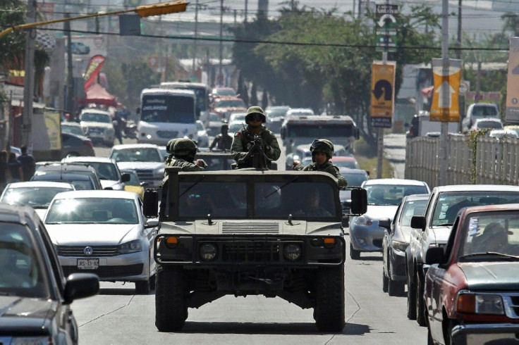 Soldiers patrol an avenue in Guadalajara