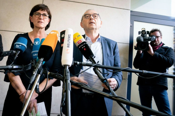 New leaders of Germany's Social Democratic Party (SPD) Norbert Walter-Borjans (R) and Saskia Esken will be formally confrmed at the party's congress