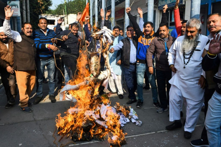 Activists protest against the rape and murder of a 27-year-old woman in India. Police later shod dead the four detained suspects as they re-enacted the crime