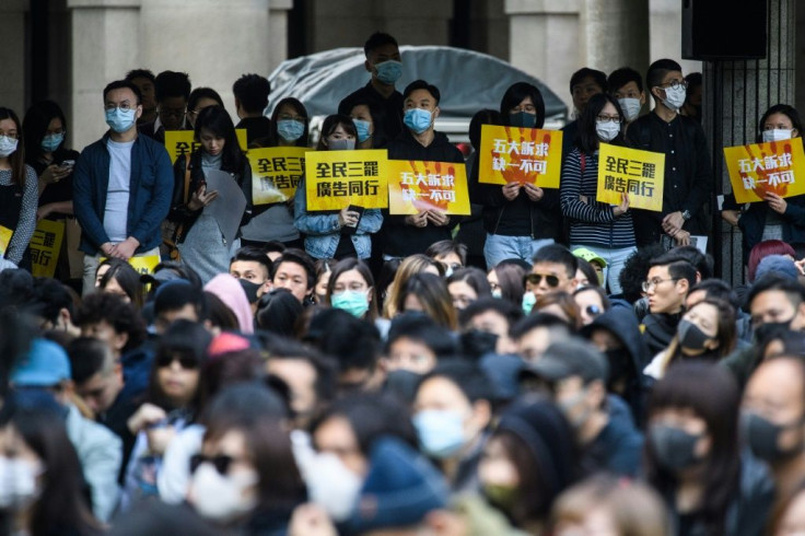 A rally by workers from the advertising sector this week. Violence has lessened in Hong Kong protests following recent local elections