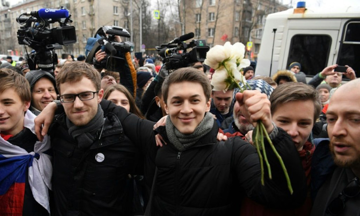 Russian student and blogger Yegor Zhukov is surrounded by supporters outside Moscow's Kuntsevsky district court after getting his suspended sentence
