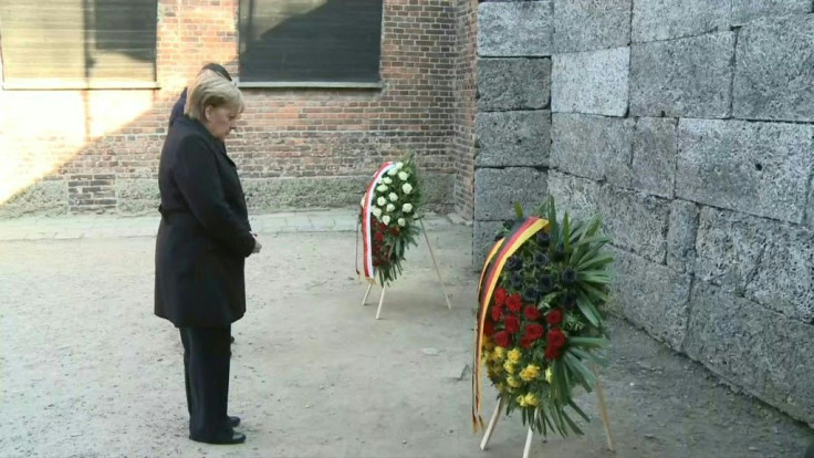 Angela Merkel pays tribute to Holocaust victims at the "Death Wall" in the former German Nazi death camp Auschwitz