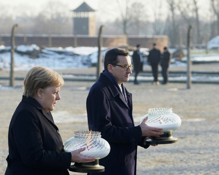 Merkel and Polish Prime Minister Mateusz Morawiecki placed candles at the International Monument Auschwitz II-Birkenau on Friday
