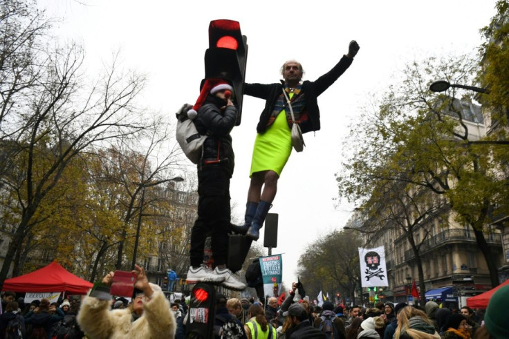 Protesters take part in a demonstration against the pension overhauls, on Place de la Nation in Paris, on December 5, 2019