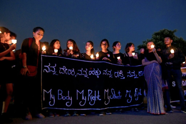 People in Bangalore hold a candlelight vigil in support of sexual assault victims and against the alleged rape of a veterinary doctor, on December 6