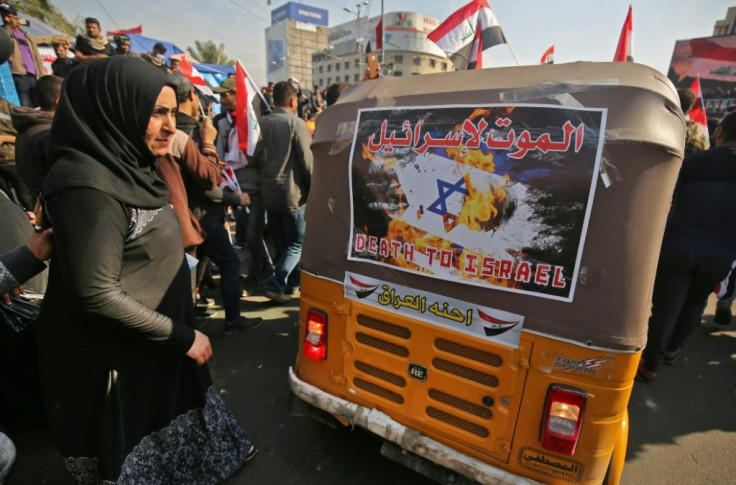 Supporters of Hashed al-Shaabi, a Shiite paramilitary network, demonstrate in Baghdad