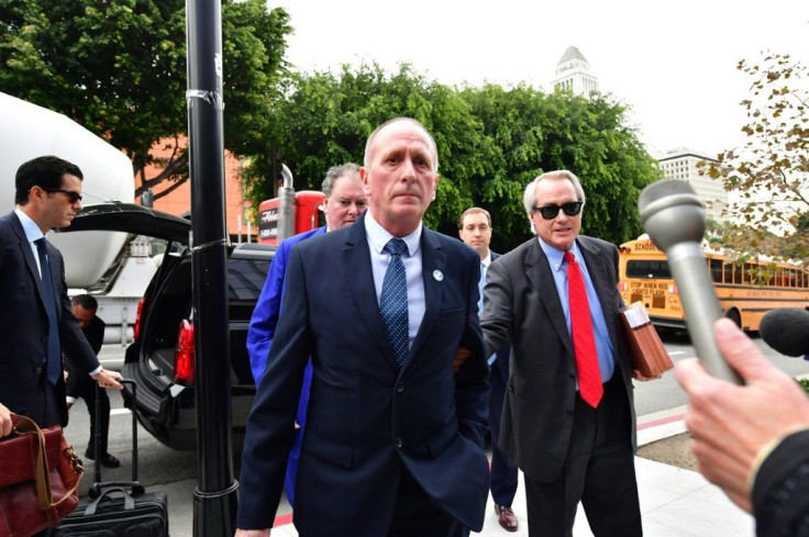 British cave diver Vernon Unsworth arrives at US District Court in Los Angeles, California on December 3, 2019 with his attorney Lin Wood (R)