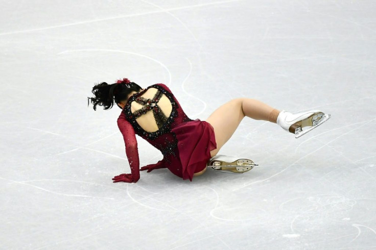 Japan's Rika Kihira falls during the women's short program in Turin.