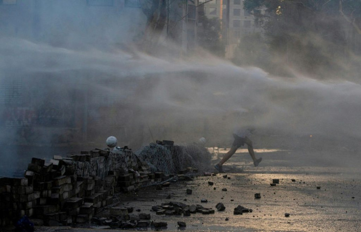 Some protesters armed with stones and Molotov cocktails clashed with police, who scattered them with tear gas and water cannon