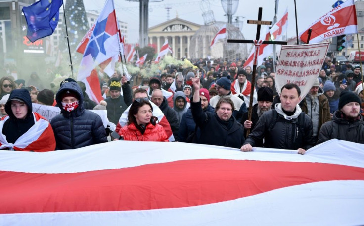 Belarusian protesters march in the capital Minsk against the prospect of closer ties with Russia