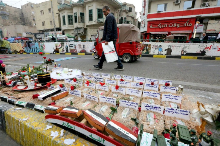 Iraqi protesters set up an installation in Bahdad's Tahrir Square to honour fallen comrades