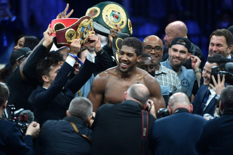 British boxer Anthony Joshua celebrates after regaining his world heavyweight crown with a unanimous points win over Andy Ruiz