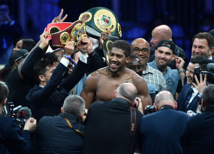 British boxer Anthony Joshua celebrates after regaining his world heavyweight crown with a unanimous points win over Andy Ruiz