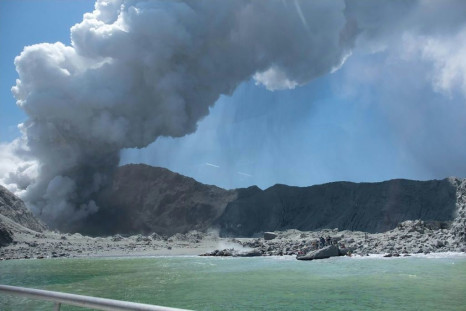 This handout photograph courtesy of Michael Schade shows the volcano on New Zealand's White Island spewing steam and ash minutes following a deadly eruption