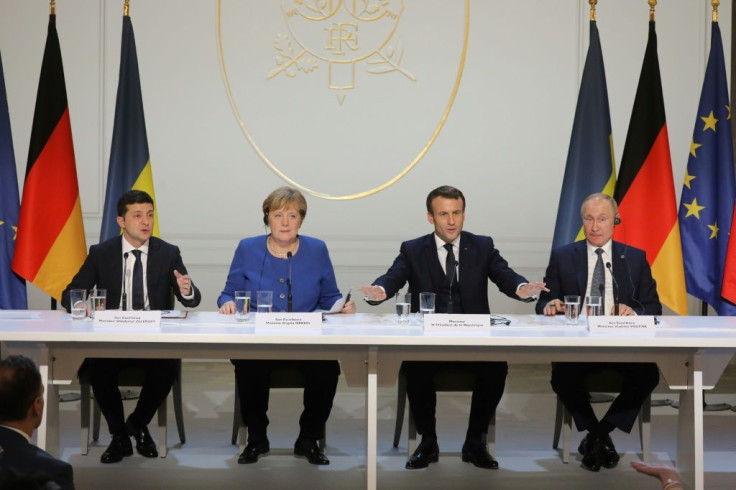 Ukrainian President Volodymyr Zelensky, German Chancellor Angela Merkel, French President Emmanuel Macron and Russian President Vladimir Putin speak at a press conference after talks on Ukraine at the Elysee Palace in Paris