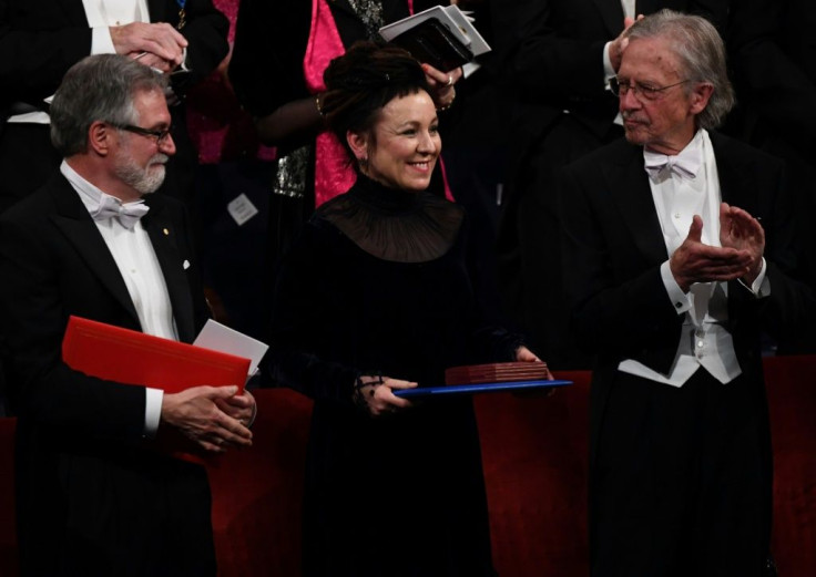 Polish author Olga Tokarczuk (C) was awarded the 2018 Nobel Prize in Literature at the ceremony