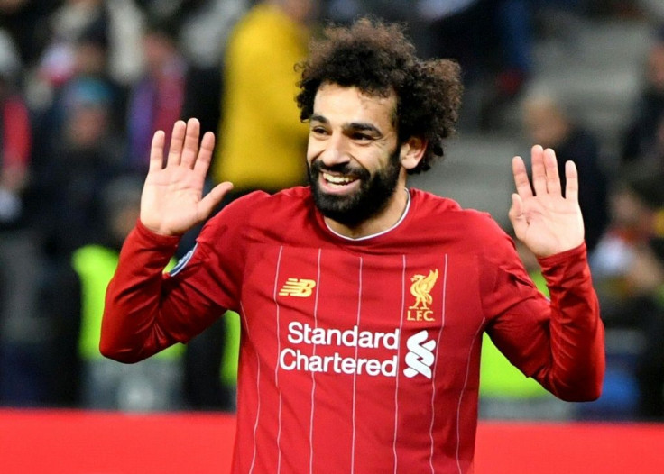 Mohamed Salah's strike from a tight angle sealed Liverpool's 2-0 win in Salzburg as they went through to the Champions League last 16