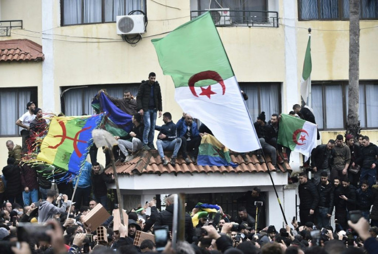 Algerian protesters have flown the Berber flag at demonstrations against presidential elections, despite a ban on symbols 'undermining national unity'