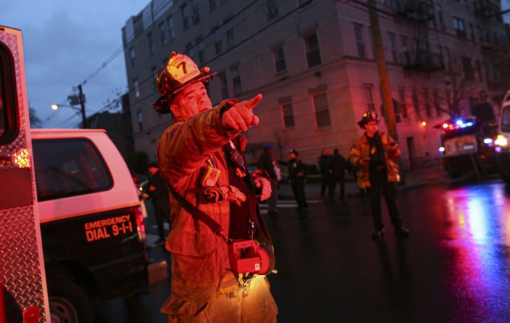 A firefighter responds to the emergency, which police said involved at least three locations