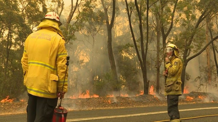 Firefighters in Australia battle an out of control fire amid scorching conditions as the east coast continues to blaze on Tuesday