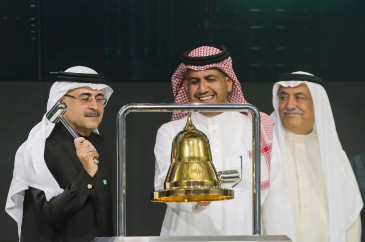Saudi Aramco President and CEO Amin Nasser (2nd L) rang the bell during the official ceremony launching the debut of the oil giant's IPO on the Riyadh's stock market