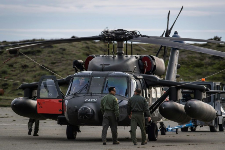 Rescue planes, including this Black Hawk helicopter, and ships continued searching waters off the southern tip of South America for the missing plane