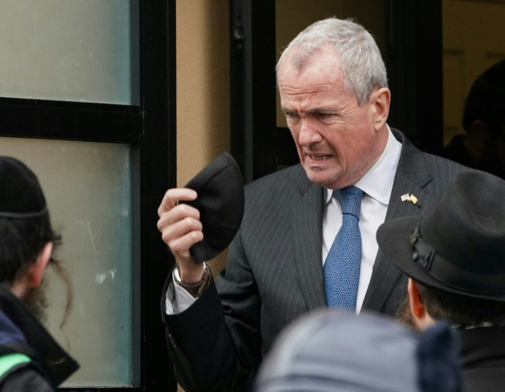 New Jersey Governor Phil Murphy visits the scene of a shooting at a Jewish deli