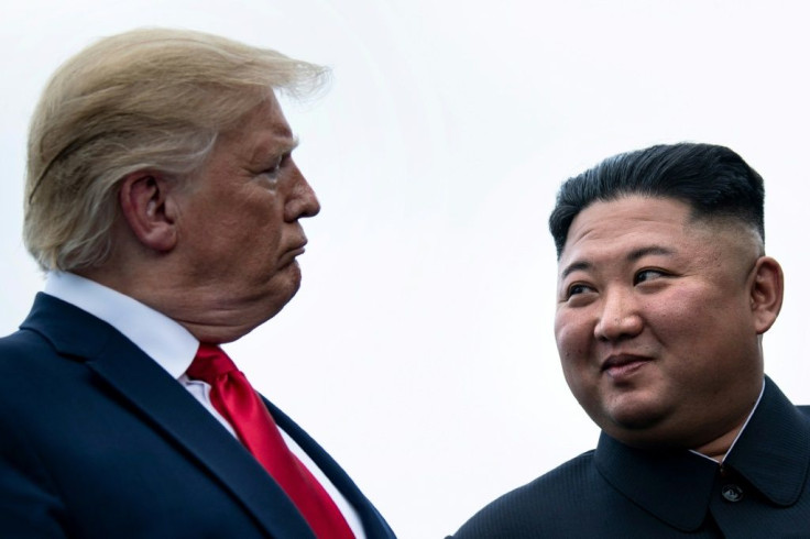 US President Donald Trump and North Korea's leader Kim Jong-un talk before a meeting in the Demilitarized Zone (DMZ) on June 30, 2019, in Panmunjom, Korea