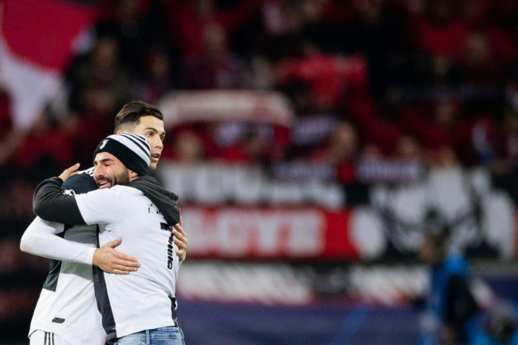 Embrace: A pitch invader hugs Ronaldo