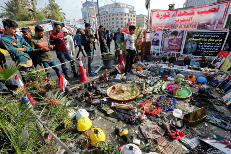 After an attack by unidentified gunmen on Iraqi protesters left 24 dead, demonstrators in Tahrir Square created a memorial to the slain