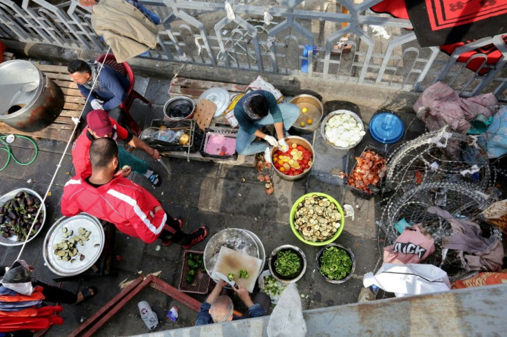 Iraqi volunteers prepare three meals a day for protesters staying in Baghdad's Tahrir Square encampment