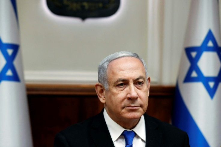 Israeli Prime Minister Benjamin Netanyahu has agreed to step down from all of his ministerial posts by the end of the year, but campaigners say he should give up the premiership too following his indictment on corruption charges last month