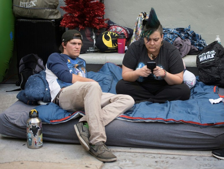 Star Wars fans wait outside the TCL Chinese Theater one week before the release of "Star Wars: The Rise of Skywalker" movie in Hollywood, California on December 12, 2019