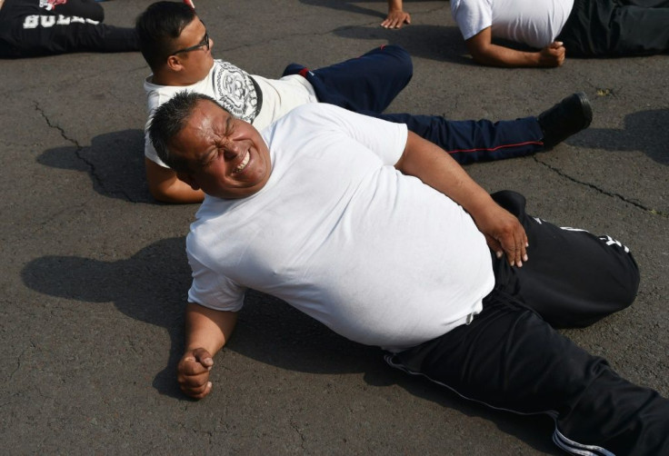 Mexican police officers exercise at a station in Mexico City, part of a program to tackle obesity in the police force