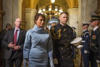 Melania Trump, escorted by a U.S. Marine, arrives at the 58th Presidential Inauguration