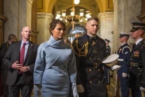 Melania Trump, escorted by a U.S. Marine, arrives at the 58th Presidential Inauguration