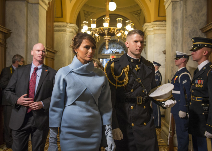 Melania Trump, escorted by a U.S. Marine, arrives at the 58th Presidential Inauguration