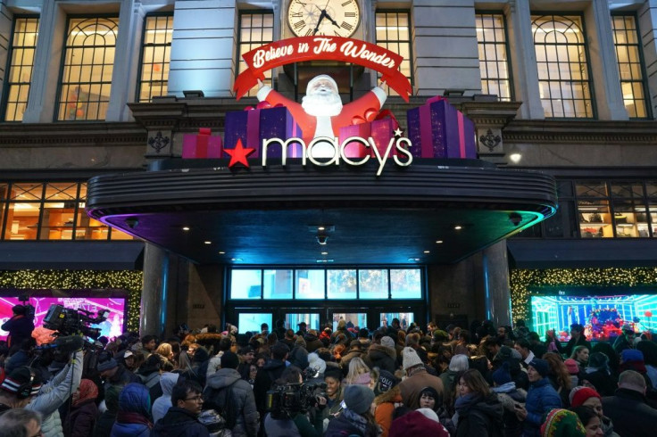 Shoppers wait to enter a Macy's department store on Thanksgiving Day. Department store sales fell 0.6 percent in November 2019