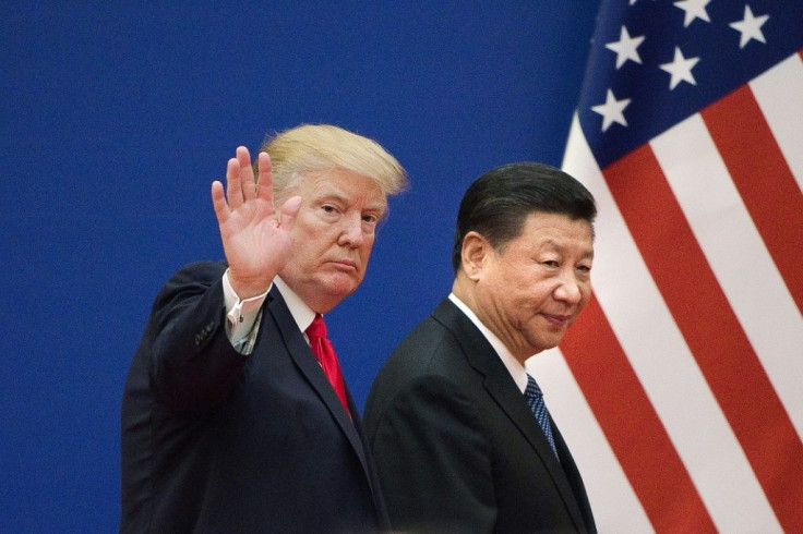 This file photo taken on November 09, 2017 shows US President Donald Trump and China's President Xi Jinping leaving a business leaders event at the Great Hall of the People in Beijing