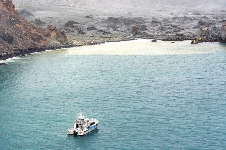 Divers searching the contaminated waters around New Zealand's volcanic White Island on Saturday failed to locate one body seen floating in the area several days ago