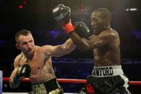 Egidijus Kavaliauskas lands a left to the face of American Terence Crawford who retained his WBO title at Madison Square Garden