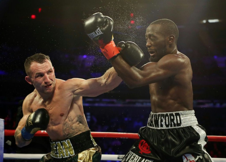 Egidijus Kavaliauskas lands a left to the face of American Terence Crawford who retained his WBO title at Madison Square Garden