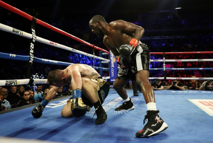 Terence Crawford knocks down Lithuania's Egidijus Kavaliauskas during their world title bout at Madison Square Garden