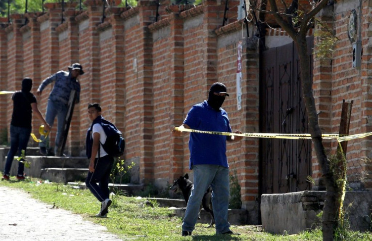 Authorities at work in  the El Mirador neighborhood of Tlajomulco de Zuniga in Jalisco, Mexico, where the remains of at least 50 people were found in a mass grave