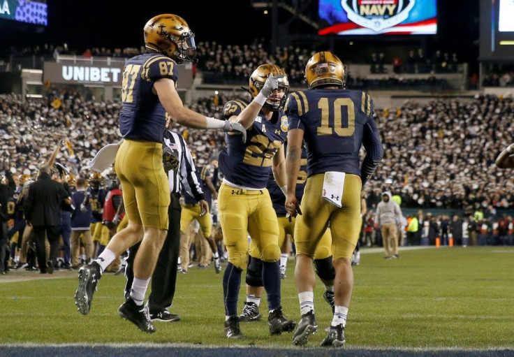 The Navy Midshipmen celebrate a touchdown in Saturday's game against the Army Black Knights