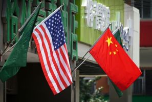 The US (L) and Chinese flags (R) displayed outside a hotel in Beijing