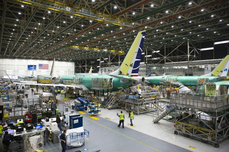 Production of 737 MAX planes, shown here in a Boeing factory in March 2019, will be suspended