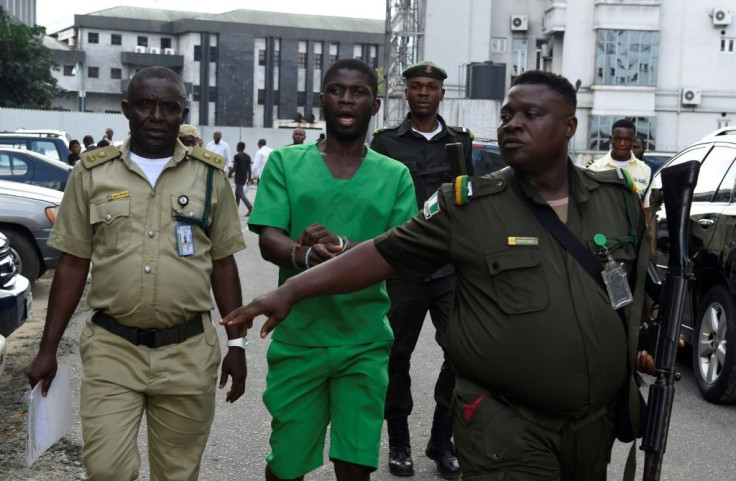 Suspected serial killer Gracious David-West, centre, being led into court on November 18